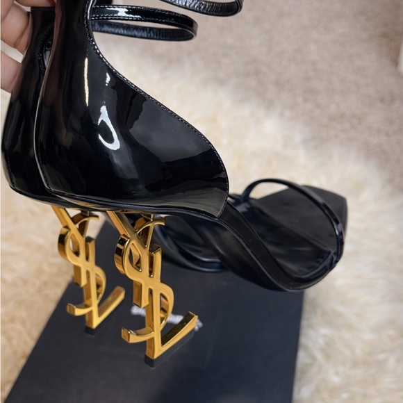 Yves Saint Laurent Shoes - Yves Saint Laurent Black Heels with Gold Logo Accent